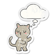 cartoon cat and thought bubble as a distressed worn sticker