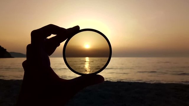 sea sunset through a polarizing photo glass