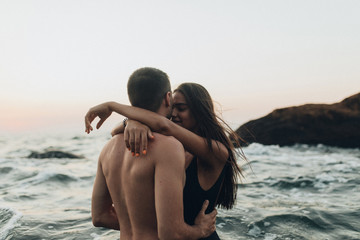 lovely couple kissing in the sea