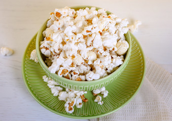 Close up of popcorn in green bowl. Good movie viewing