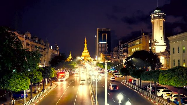 Streets of downtown Yangon on the road to Sule Pagoda timelapse with traffic jam and modern city