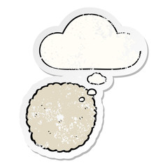 cartoon biscuit and thought bubble as a distressed worn sticker