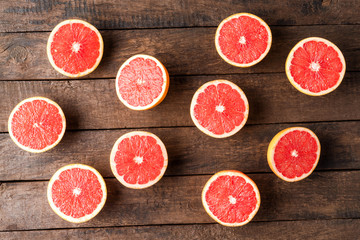 Grapefruit halves on wooden table. Top view