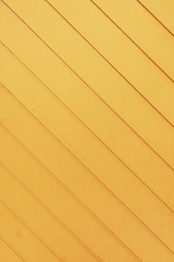Very bright yellow diagonal striped wooden board