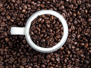 white cup of coffee beans