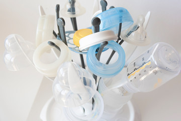 Baby bottles drying on the rack - newborn essentials