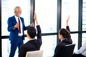 Business Team work concept. Modern businessman explaining his ideas to colleagues at seminar