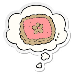 cartoon biscuit and thought bubble as a printed sticker