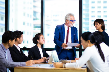 Business Team work concept. Modern businessman explaining his ideas to colleagues at seminar
