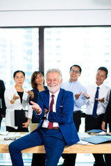 business teamwork concept. Group of business people with businessman leader on foreground