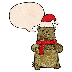 cartoon bear wearing christmas hat and speech bubble in retro texture style