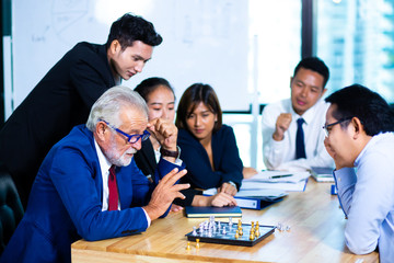 Multi-ethnic business people having discussion at conference table in office