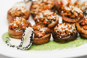 vegan gluten-free champignon with fiery vegetable and nuts, spinach emulsion