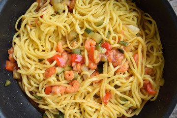 A first course with a Mediterranean flavor - spaghetti with shrimp and zucchini