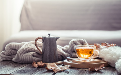 Cozy autumn still life with a cup of tea
