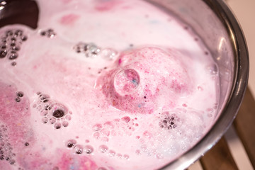 The bright bath bomb dissolves in water .