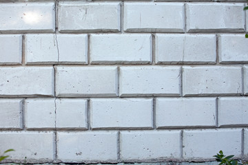white wall from concrete blocks with big crack
