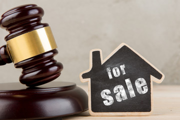 Real estate concept -auction gavel and little house with inscription For Sale