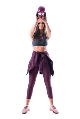 High position kettlebell swing exercise by young attractive fitness woman. Full body isolated on white background. 