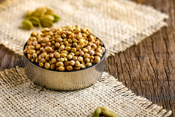 Colorful mix of different spices  on a wooden board