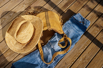 Trendy summer outfit over grunge wooden background