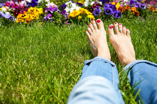 Woman Feet On Grass Barefoot