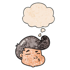 cartoon boy's face and thought bubble in grunge texture pattern style