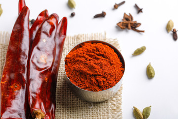 Indian spice Red chilli powder in  bowl on white background