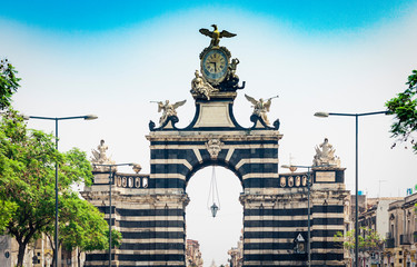Fototapeta premium street view of famous landmark – gate Porta Garibaldi in Catania, Sicily, Italy.