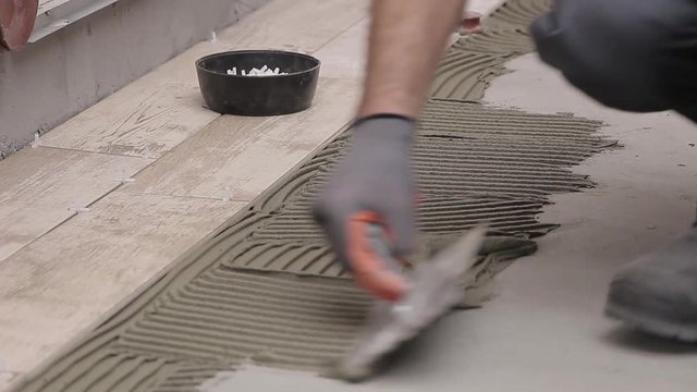 Laying tiles in bathroom
