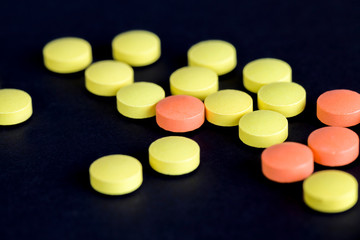 yellow and orange pills