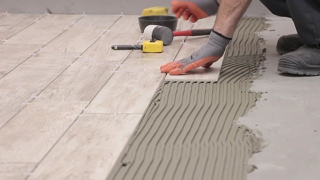 Laying tiles in bathroom