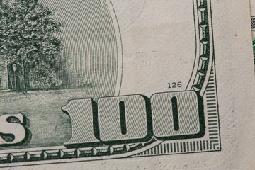 Texture of dollar bills. One hundred dollars. Close-up, macro.