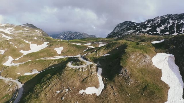Aerial view of serpantine road high in the mountains