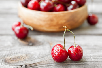 Fresh cherries on wooden background. Red ripe cherry. Food background
