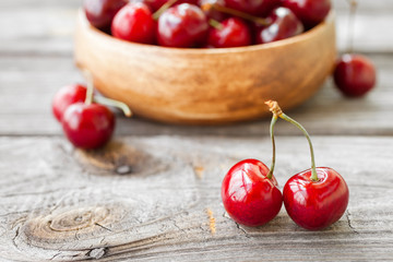 Fresh cherries on wooden background. Red ripe cherry. Food background