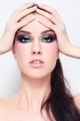 Portrait of young beautiful girl with bright fancy makeup
