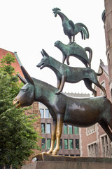 Bremen, Germany - 06/13/2019: famous sculpture of Bremen musicians. Bronze monument of fairytale animals. Heritage of Grimm brothers. Fairytales concept. Bremen sightseeing. Bremen landmark. 