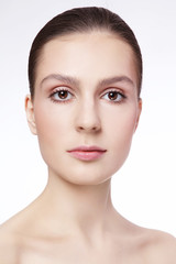 Obraz premium Portrait of young beautiful woman with clean makeup