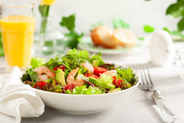 Fresh summer salad with shrimp, avocado and tomato