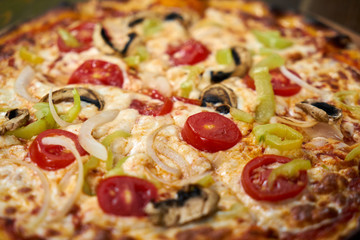 Delicious pizza with vegetables on the table