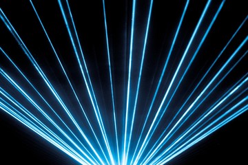 Blue laser show nightlife club stage and shining sparkling rays. Luxury entertainment in nightclub...