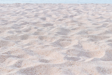 Sand on sandy beach texture background (shallow focus)