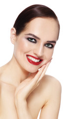 Obraz premium Portrait of young beautiful happy smiling woman with smoky eye makeup and red lips
