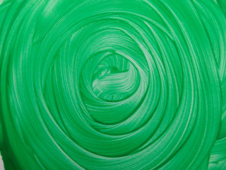 The spiral of green paint with volume effect