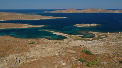 Aerial drone panoramic distant view of famous archaeological site a whole ancient citadel in island of Delos, Cyclades, Greece
