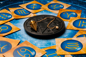 magic pentagram, esoteric pendulum and astrology zodiac signs 