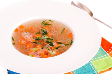 Dietary vegetable soup with carrots, peas and green onions. 