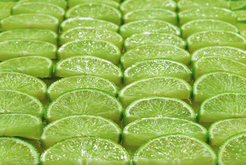 Fresh lime slices as a background.