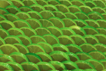Obraz premium Fresh lime slices as a background.